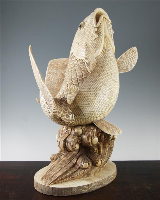 A large Oriental sectional bone figure of a leaping carp, 25.5in.